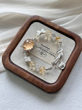 15. Handcrafted Floral Charm Silver Bracelet