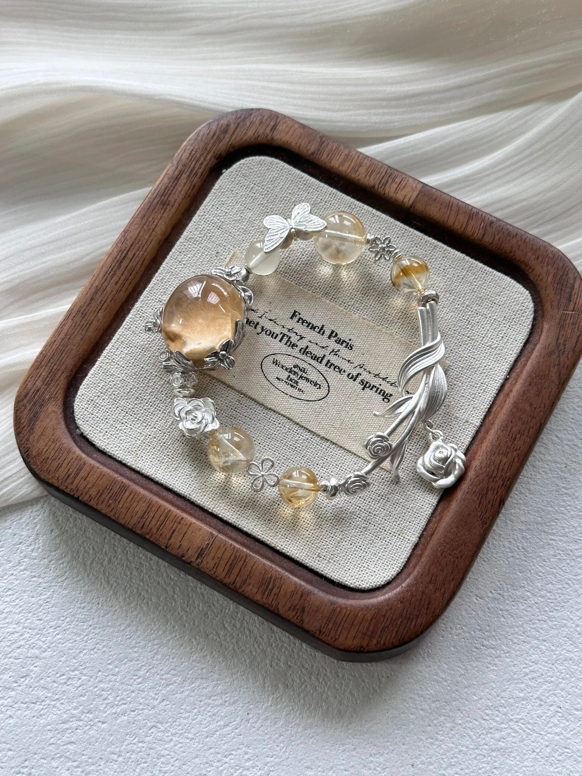 15. Handcrafted Floral Charm Silver Bracelet